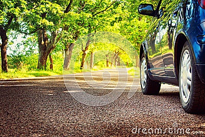 Car on asphalt road in summer Stock Photo