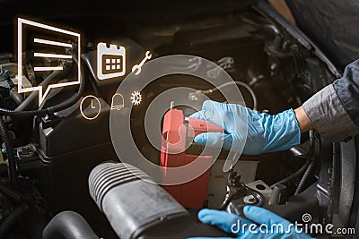 Car battery care, Mechanic checking battery. Stock Photo