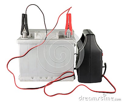 Car battery with two jumper cables clipped to the terminals isolated on white Stock Photo