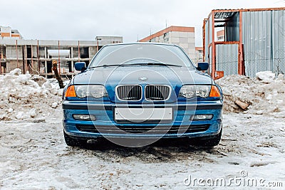 car BMW 3 Series E46 318i on the background of construction site. Fourth generation of compact executive blue colour car in winter Editorial Stock Photo