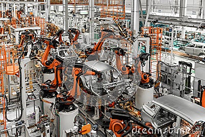 Car bodies are on assembly line. Factory for production of cars. Modern automotive industry. Electric car factory Stock Photo