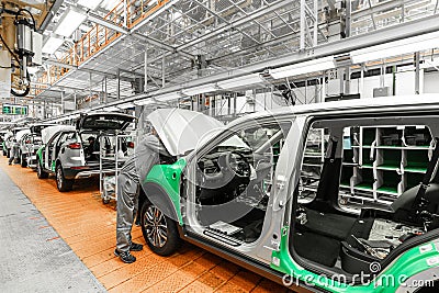 Car bodies are on assembly line. Factory for production of cars. Modern automotive industry. Electric car factory Editorial Stock Photo