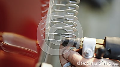 Car body repair welding and restoration. Man welding a part of the car and preparing it for a general repair welding Stock Photo