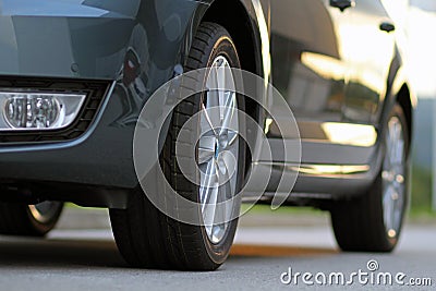 Car with brand new tires, low angle view Stock Photo