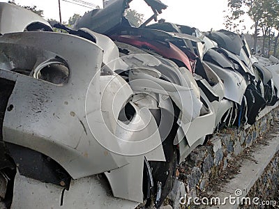 car bumper damaged dusty, cracked, brittle exposed to the sun Stock Photo