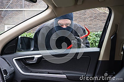 Car burglar in action Stock Photo