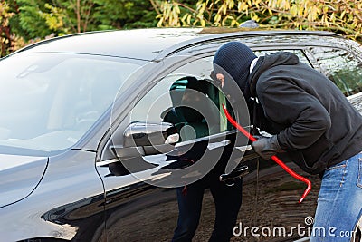 Car burglar in action Stock Photo
