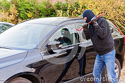 Car burglar in action Stock Photo