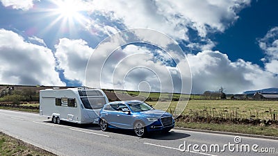 Car and Caravan on the road Stock Photo