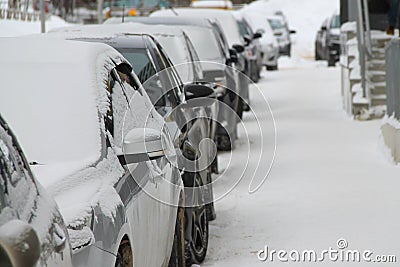 Car on a city street in winter covered with snow Stock Photo