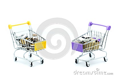 Car and coins in shopping cart,auto loan concept. Stock Photo