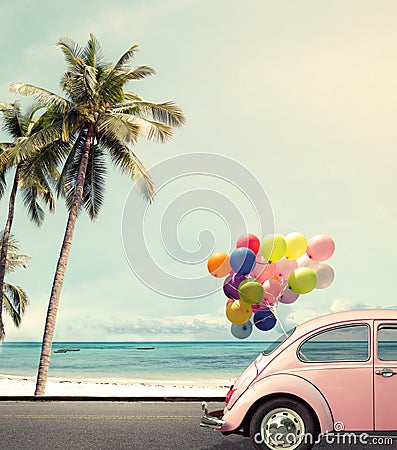 Car with colorful balloon on beach blue sky Stock Photo