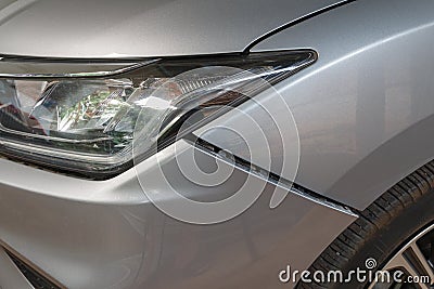 Car crash or accident. Front fender and light damage on bumper. Stock Photo