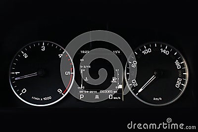 Car dashboard, illuminated panel, speed display. Car. Black Stock Photo