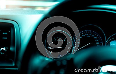 Car dashboard interior view. Car instrument panel with tachometer and speedometer. View from steering wheel to rpm gauge and speed Stock Photo