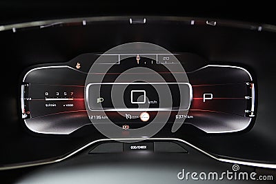 Car dashboard panel with speedometer, tachometer, odometer, fuel gauge and gear position indicator. Stock Photo