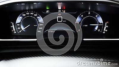 Car dashboard panel with speedometer, tachometer, odometer, fuel gauge and gear position indicator. Stock Photo