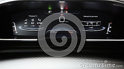 Car dashboard panel with speedometer, tachometer, odometer, fuel gauge and gear position indicator. Stock Photo