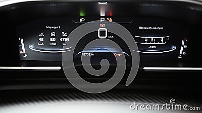 Car dashboard panel with speedometer, tachometer, odometer, fuel gauge and gear position indicator. Stock Photo