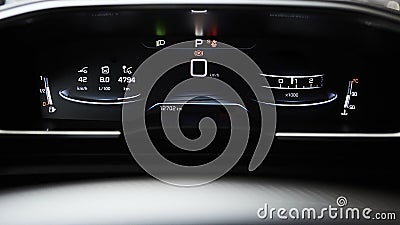 Car dashboard panel with speedometer, tachometer, odometer, fuel gauge and gear position indicator. Stock Photo