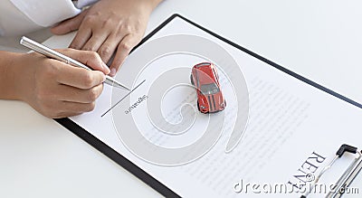 Car dealers or insurance managers cover and protect against damage and the risk of driving Stock Photo