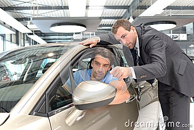 Car dealership advice - sellers and customers when buying a car Stock Photo