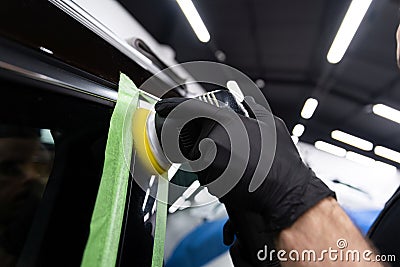 Car detailing studio polishing piano black color car element Stock Photo