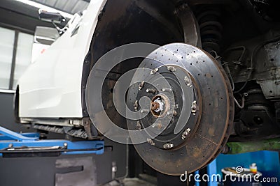 car disc brake wating for tire replacement in the garage Stock Photo