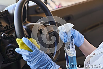 Car disinfecting service. Cleansing car interior and spraying with disinfection liquid Stock Photo