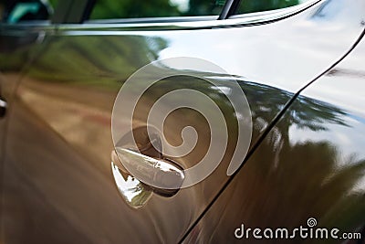 Car door handle of a sport car on the street, soft focus, selective focus on handle Stock Photo