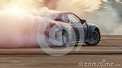 Car drifting, Blurred image diffusion race drift car with lots of smoke from burning tires on speed track Stock Photo
