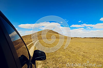 A car drive to the Hill under the blue sky Stock Photo