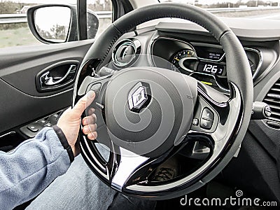 Car driver hand on the wheel on cruise control driving Editorial Stock Photo