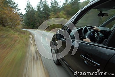 Car driving on country road Stock Photo