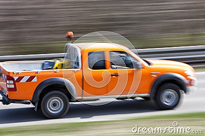 Car driving down country road Stock Photo