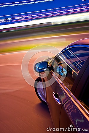 Car driving fast Stock Photo