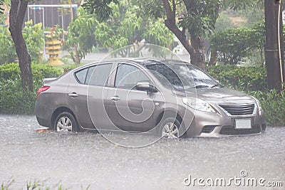 Car driving flood water, it`s raining heavily hard, Some of the flooded area is flooded Editorial Stock Photo