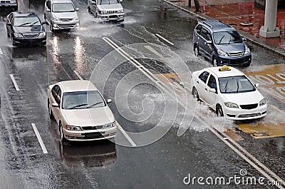 Car Driving On Flooded Street Stock Photo