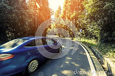 Car driving on the road in mountains Stock Photo