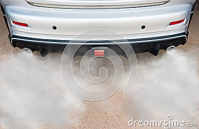 Car exhaust pipe comes out strongly of smoke Stock Photo