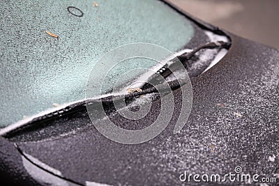 Car frozen windscreen and windscreen wipers after freezing rain Stock Photo