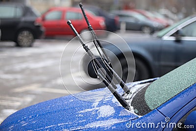 Car frozen windscreen and windscreen wipers after freezing rain Stock Photo