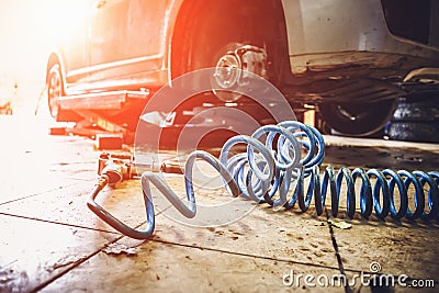 Car in garage in auto mechanic repair service work shop with special machine repairing equipment Stock Photo