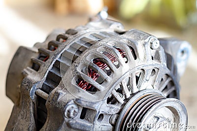 Old car power generator after repair. A new rewound loop is visible Stock Photo