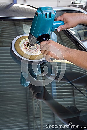 Car Glass polishing with power buffer machine Stock Photo