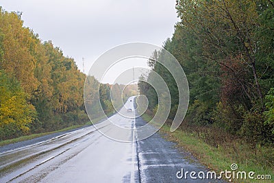 The car is going on a wet road Stock Photo