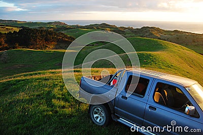 Car at green hill top rural area Editorial Stock Photo
