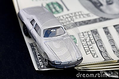 Car and hundred dollar bills Stock Photo