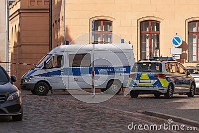 Car with the inscription Criminal police and police at the scene Editorial Stock Photo