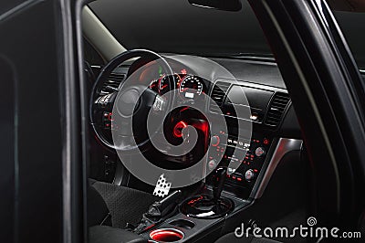 Car inside gray seats red dashboard night photography in the dark Stock Photo